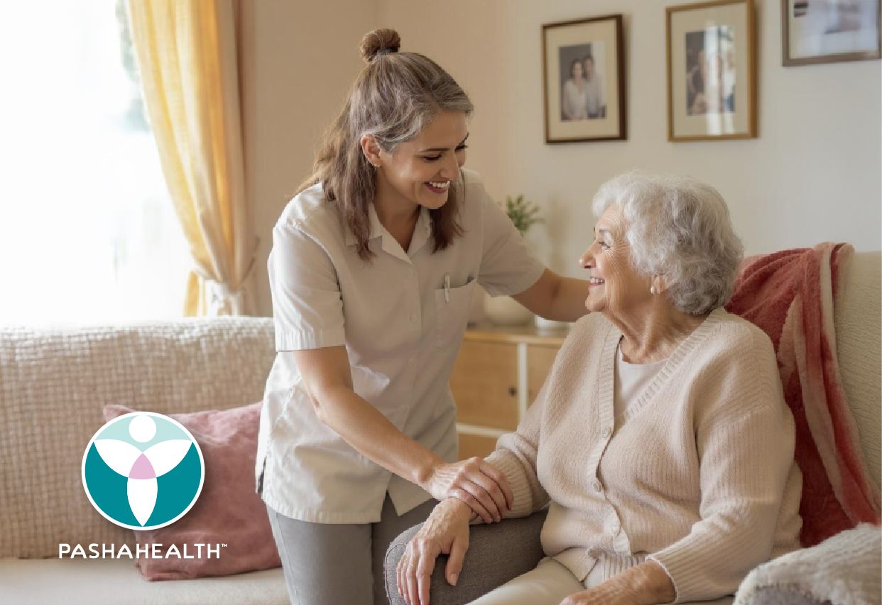 A Pasha Health caregiver assists an elderly woman with Alzheimer's disease in her home