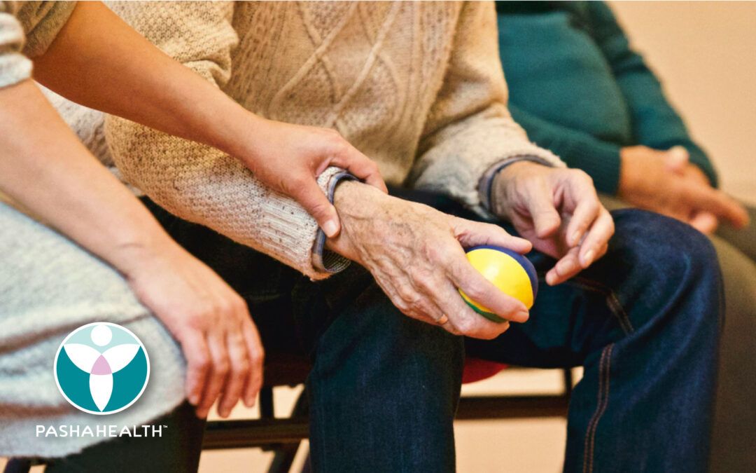 Adult child sitting with elder parent.
