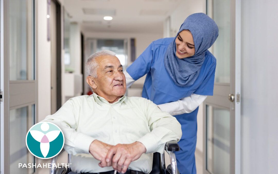 An elderly man and a care provider speaking to each other.
