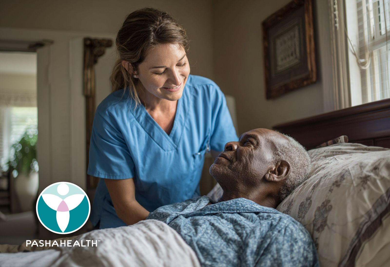 Pasha Health caregiver at a client's bedside in his home