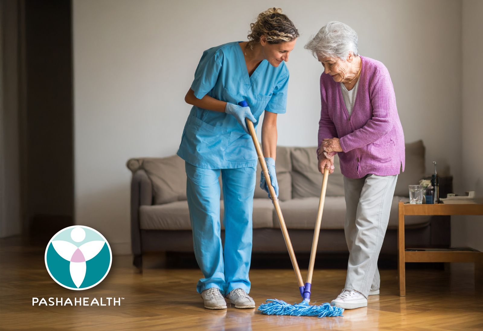 Pasha Health caregiver and senior cleaning the floor together