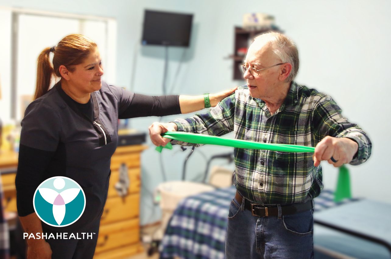 A Pasha Health home care expert working with a client on strength and mobility