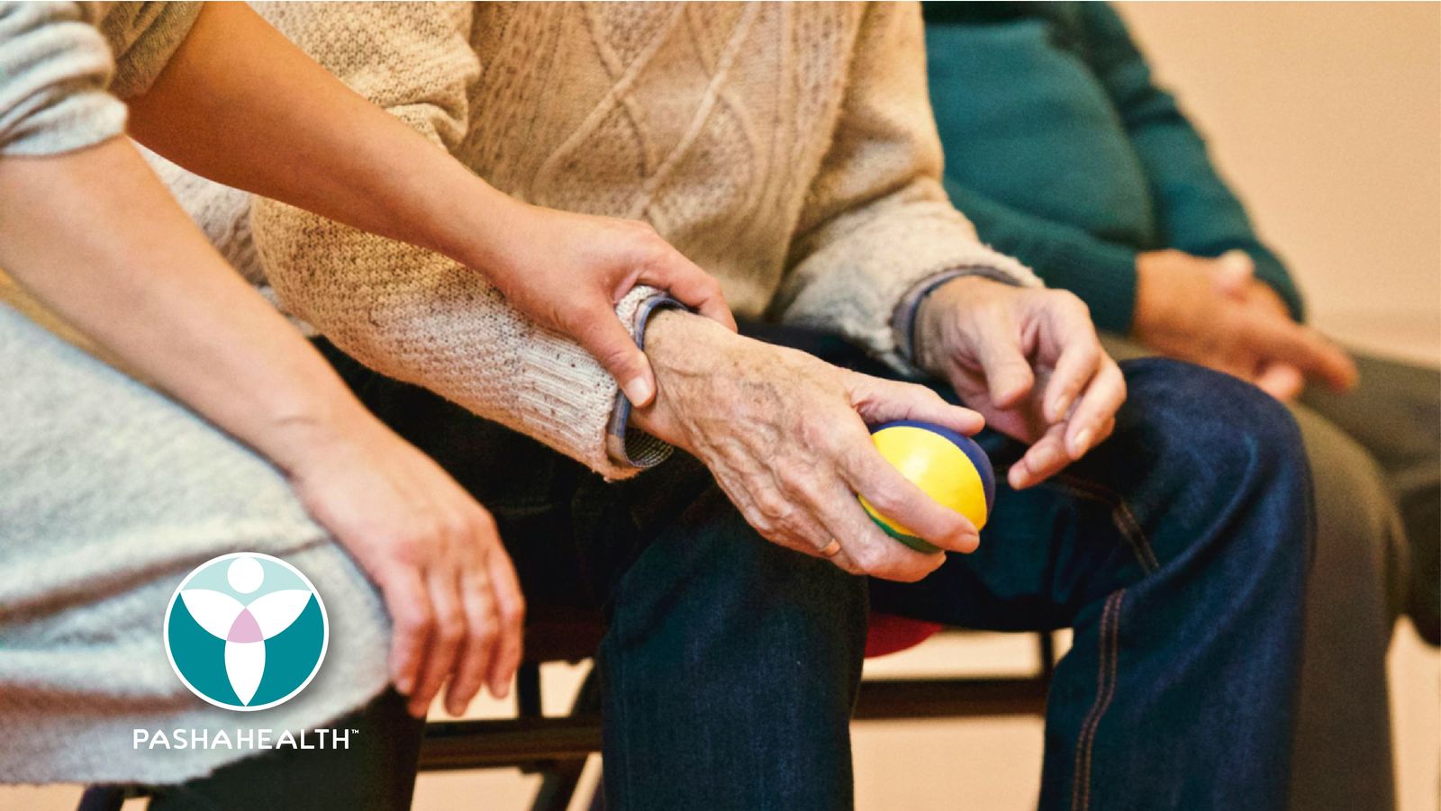A caregiver's hand resting on an elder client's hands