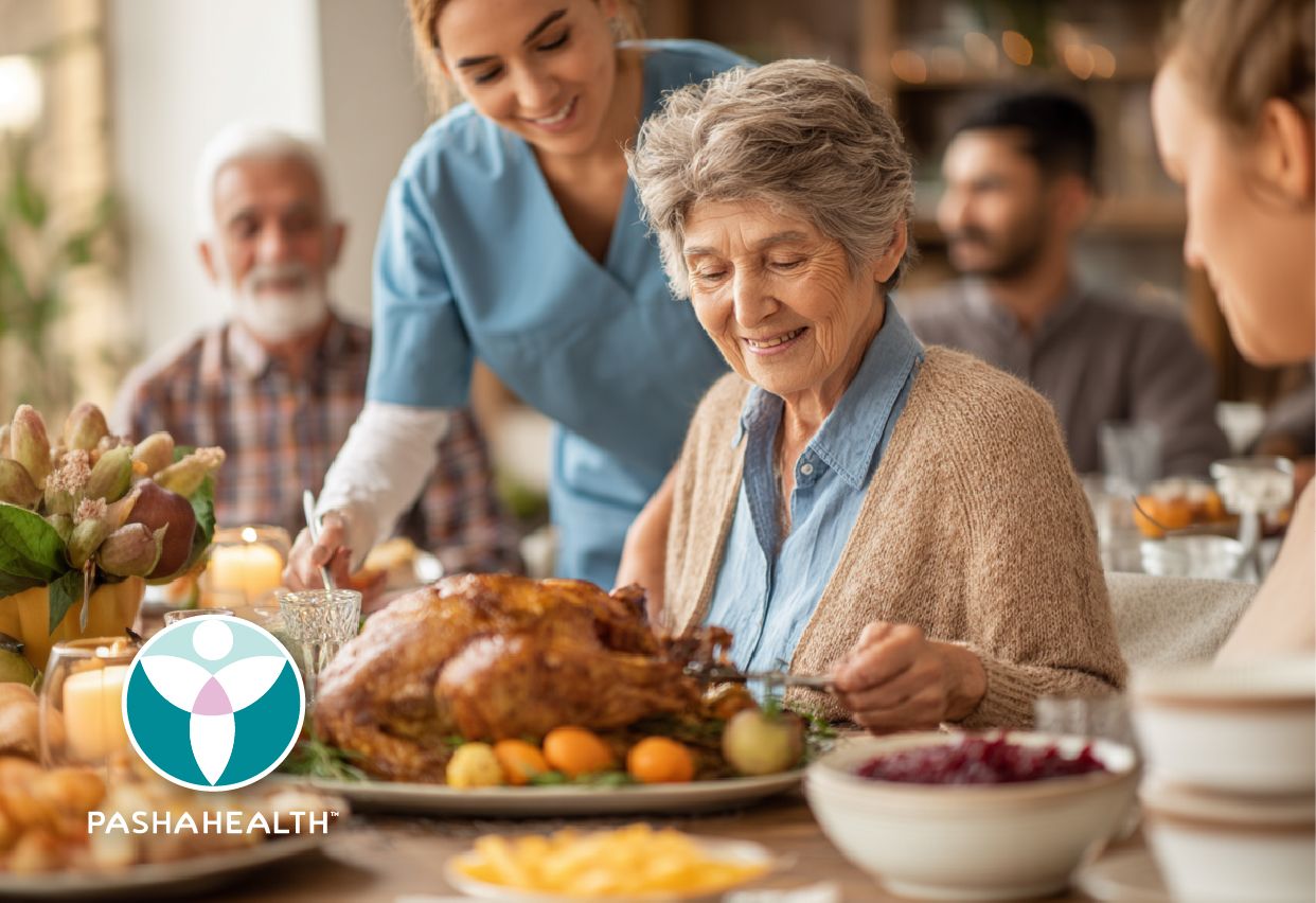 A family and Pasha Health caregiver sharing a meal around the table
